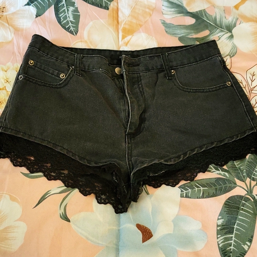 Black denim, black lace booty shorts.